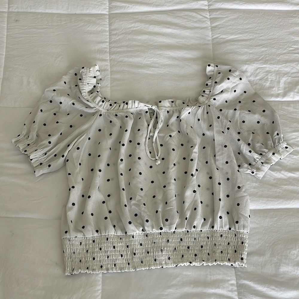 White blouse with black polka dots